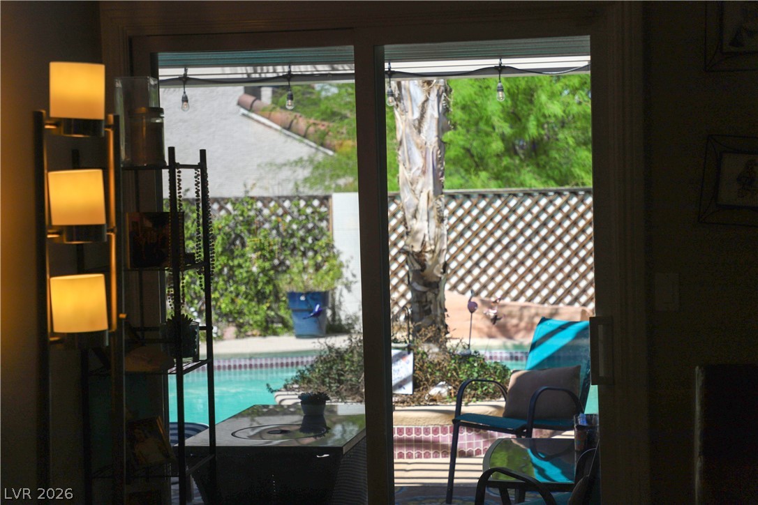 133 Coventry Circle Henderson, NV 89074 - Photo 23 of 99 Looking out onto the patio from the Living Room