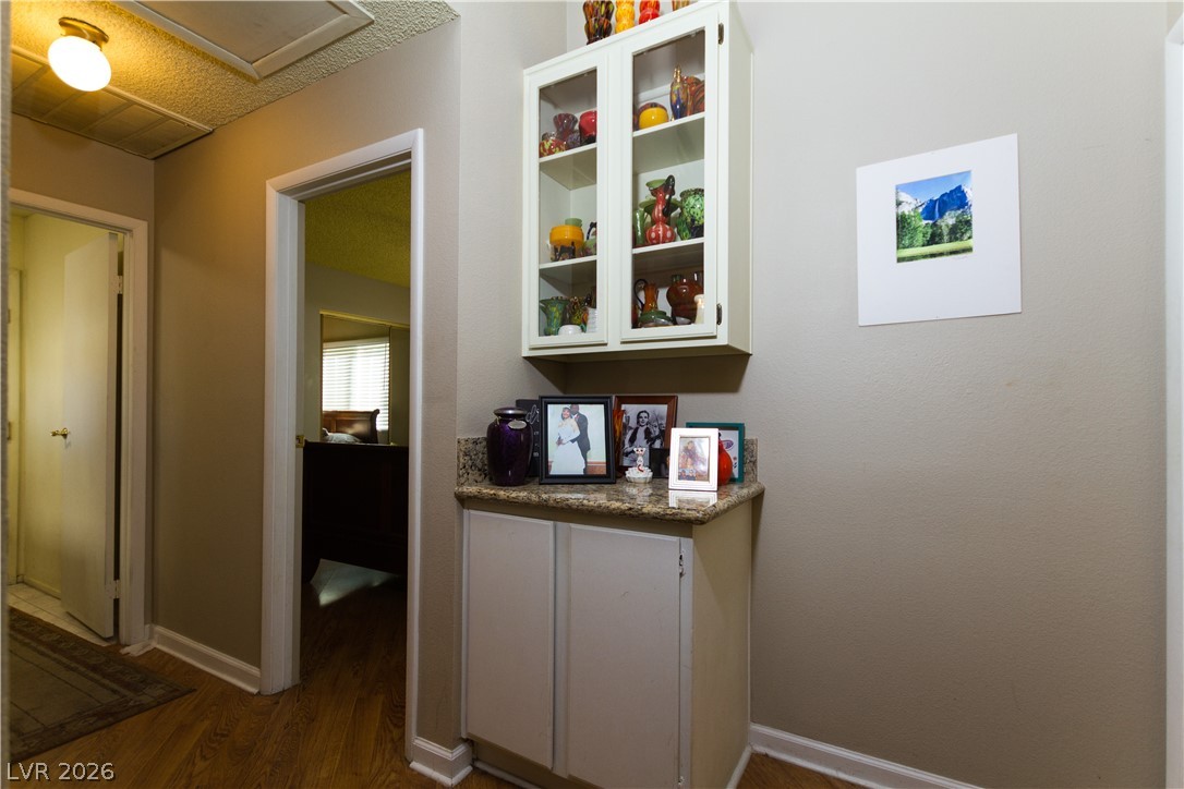 133 Coventry Circle Henderson, NV 89074 - Photo 54 of 99 Hallway. Garage to left. Bedroom 2 door open.