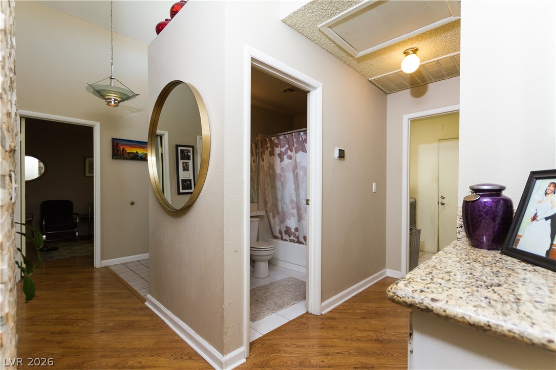 133 Coventry Circle Henderson, NV 89074 - Photo 55 of 99 Hallway to Den to left. Hallway to Garage to right.