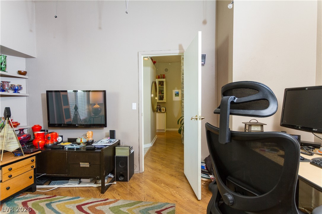 133 Coventry Circle Henderson, NV 89074 - Photo 57 of 99 Den looking down hallway towards bedrooms