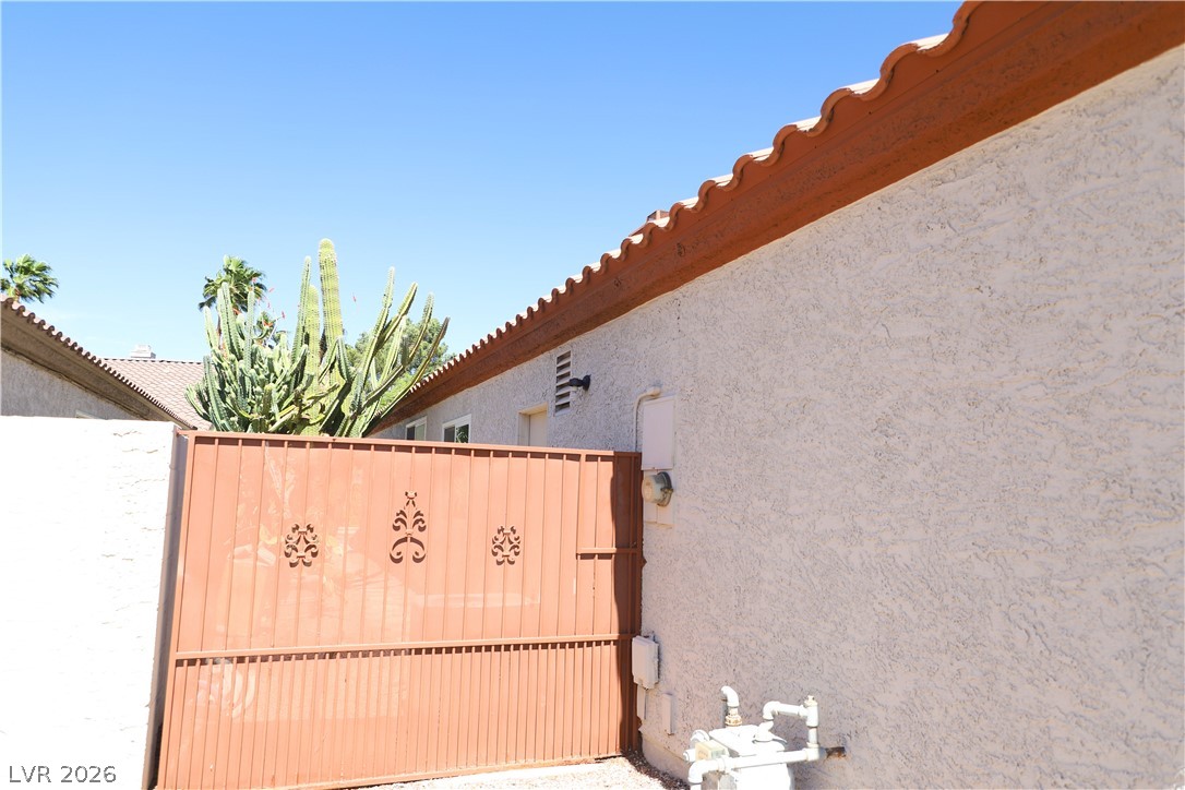 133 Coventry Circle Henderson, NV 89074 - Photo 64 of 99 Decorative Fence at side of house - not, this is NOT a gate.