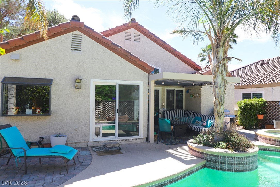 133 Coventry Circle Henderson, NV 89074 - Photo 73 of 99 Back of the home. Gardenbox Kitchen Window. New vinyl doors & windows.