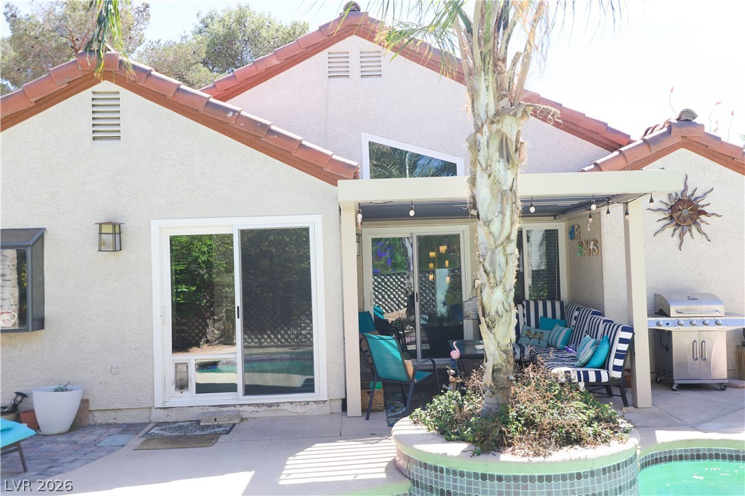 133 Coventry Circle Henderson, NV 89074 - Photo 76 of 99 Back of structure. Relax under the portico. BBQ. Swim. Relax in the spa.