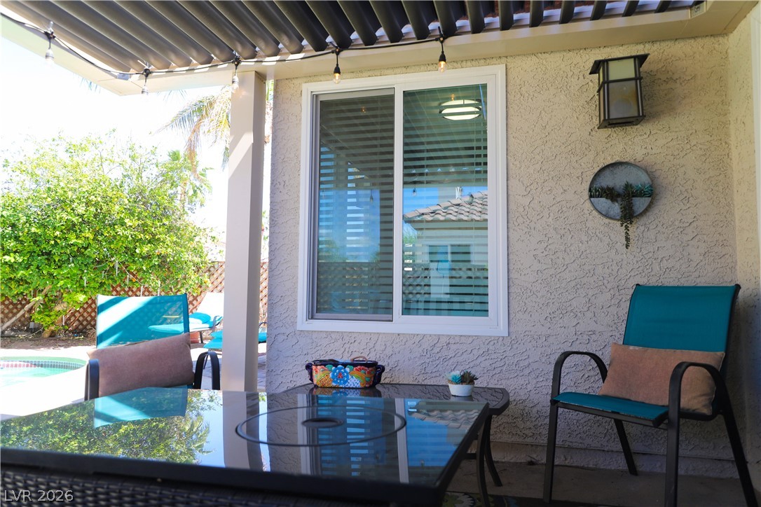 133 Coventry Circle Henderson, NV 89074 - Photo 79 of 99 Adjustable louvers above patio - choose sun or shade