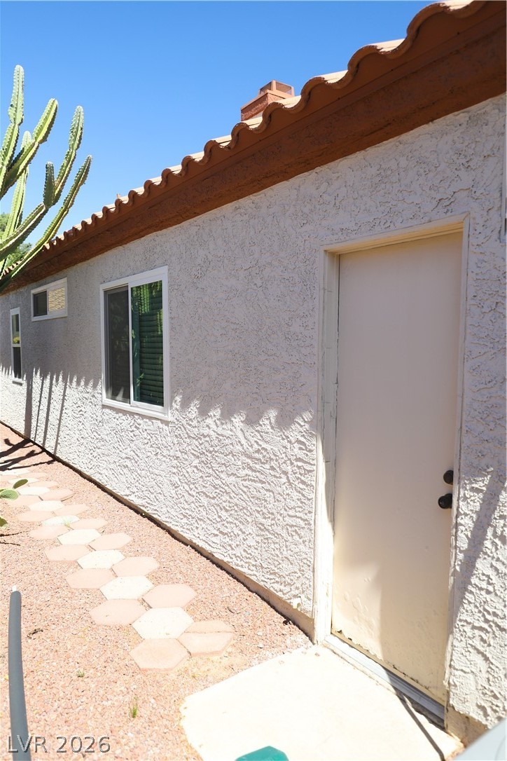133 Coventry Circle Henderson, NV 89074 - Photo 88 of 99 Side of Structure - exterior door to garage