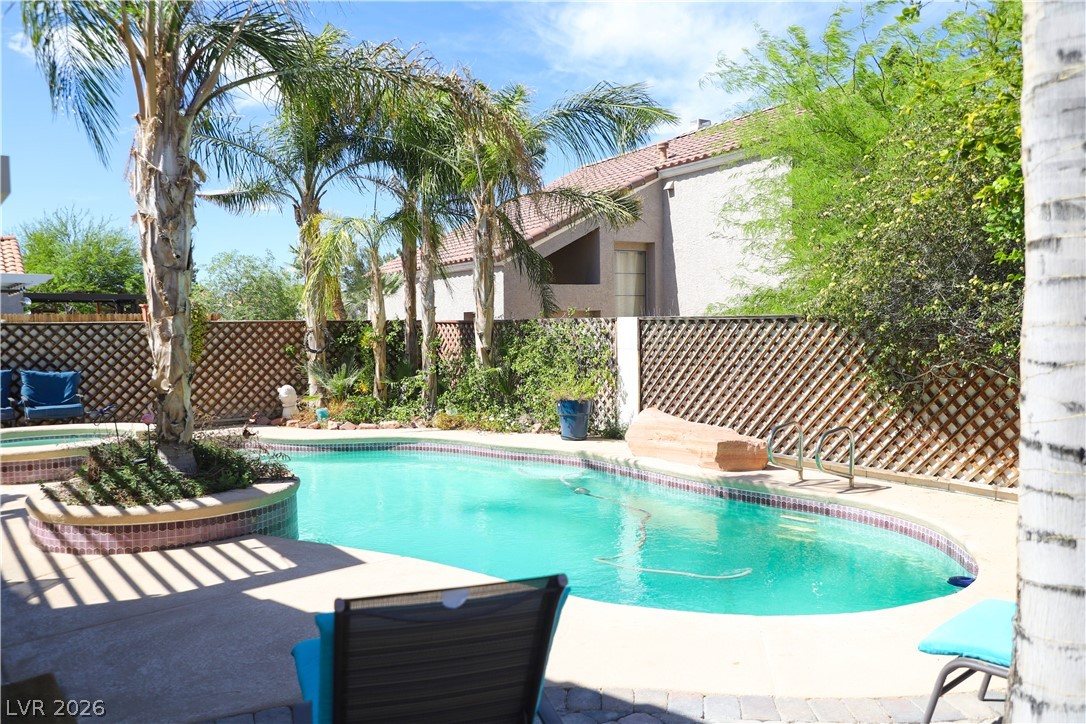 133 Coventry Circle Henderson, NV 89074 - Photo 97 of 99 Railing & steps provide secure entry and exit from the deep end of the pool