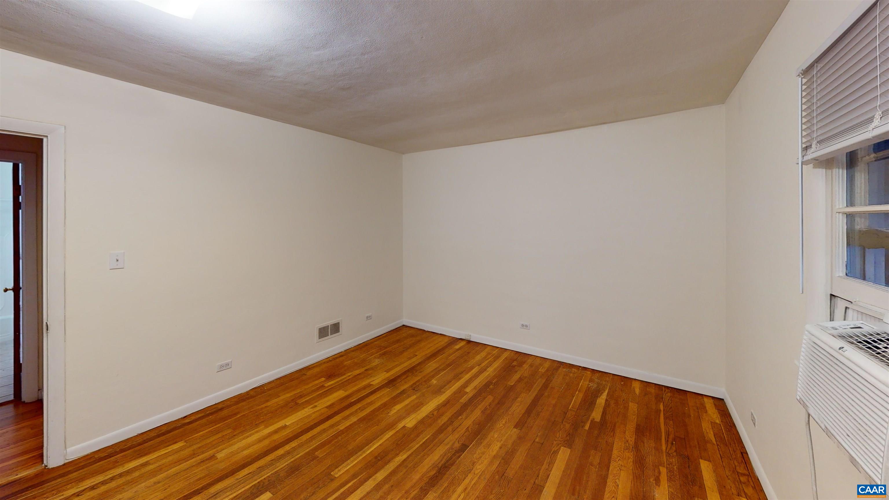 130 Apple Tree Road, Unit A Charlottesville, VA 22903 - Photo 11 of 16 a view of empty room with wooden floor