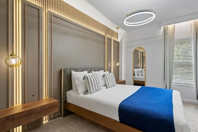 a bedroom with a bed and a window