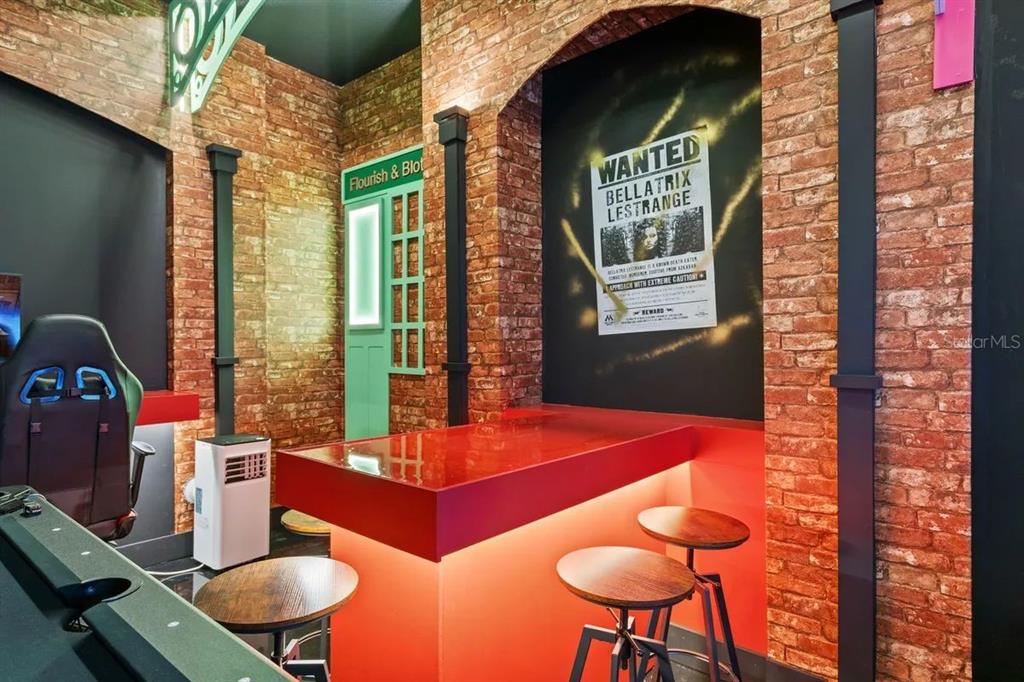 10317 Ebb Tide Lane Orlando, FL 32821 - Photo 22 of 47 a view of a dining room with furniture and chandelier