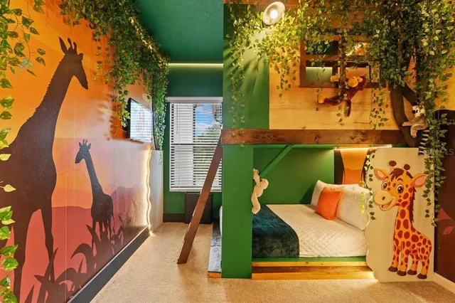 a bedroom with a bed and a painting on the wall