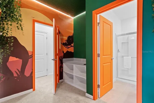 a bathroom with a double vanity sink toilet and shower