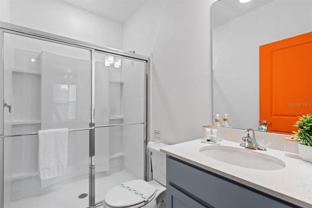 10317 Ebb Tide Lane Orlando, FL 32821 - Photo 27 of 47 a bathroom with a sink toilet and shower
