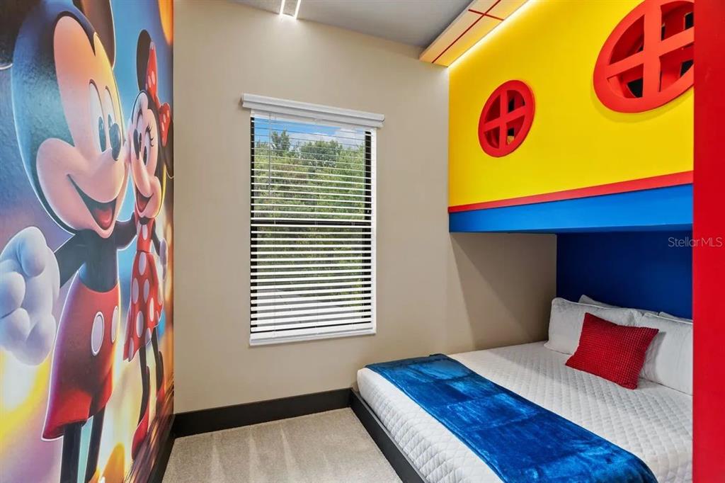 10317 Ebb Tide Lane Orlando, FL 32821 - Photo 33 of 47 a view of a bedroom with a bed and a window