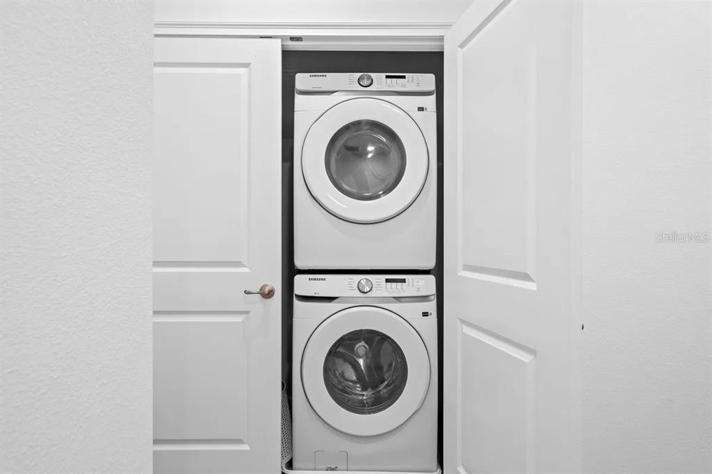 10317 Ebb Tide Lane Orlando, FL 32821 - Photo 35 of 47 a utility room with dryer and washer