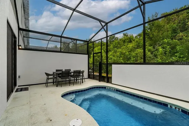 a view of swimming pool with a garden