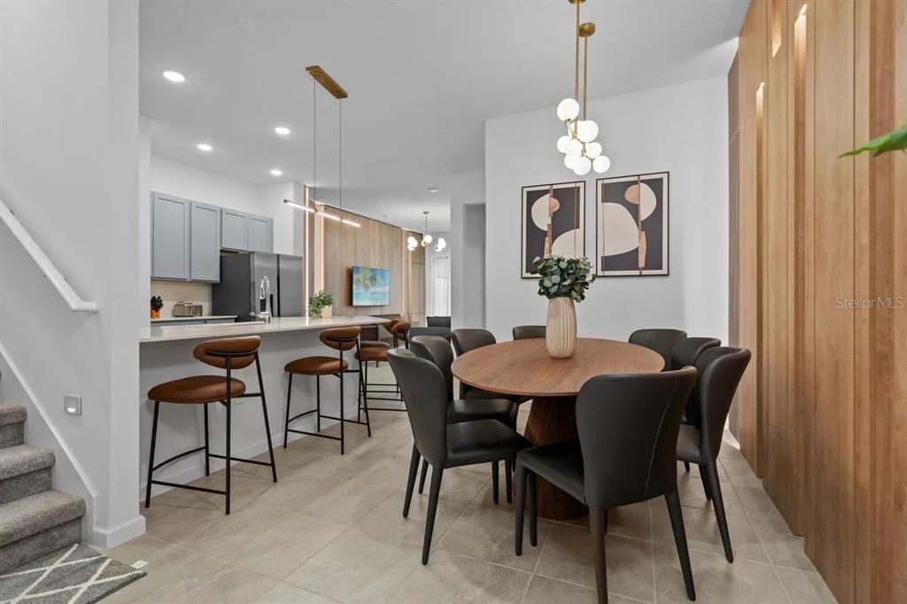 10317 Ebb Tide Lane Orlando, FL 32821 - Photo 7 of 47 a view of a dining room with furniture and chandelier