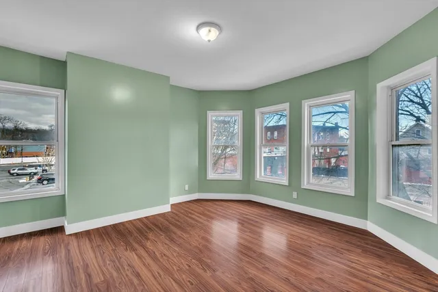 a view of livingroom with window and wooden floor