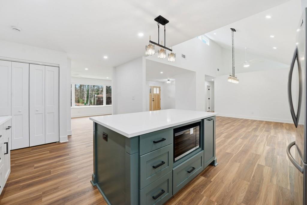 3668 Big Springs Road Decatur, GA 30034 - Photo 12 of 45 a kitchen with a sink a wooden floor and a view of kitchen