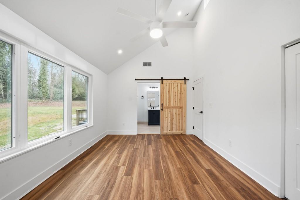 3668 Big Springs Road Decatur, GA 30034 - Photo 18 of 45 wooden floor in an empty room with a window