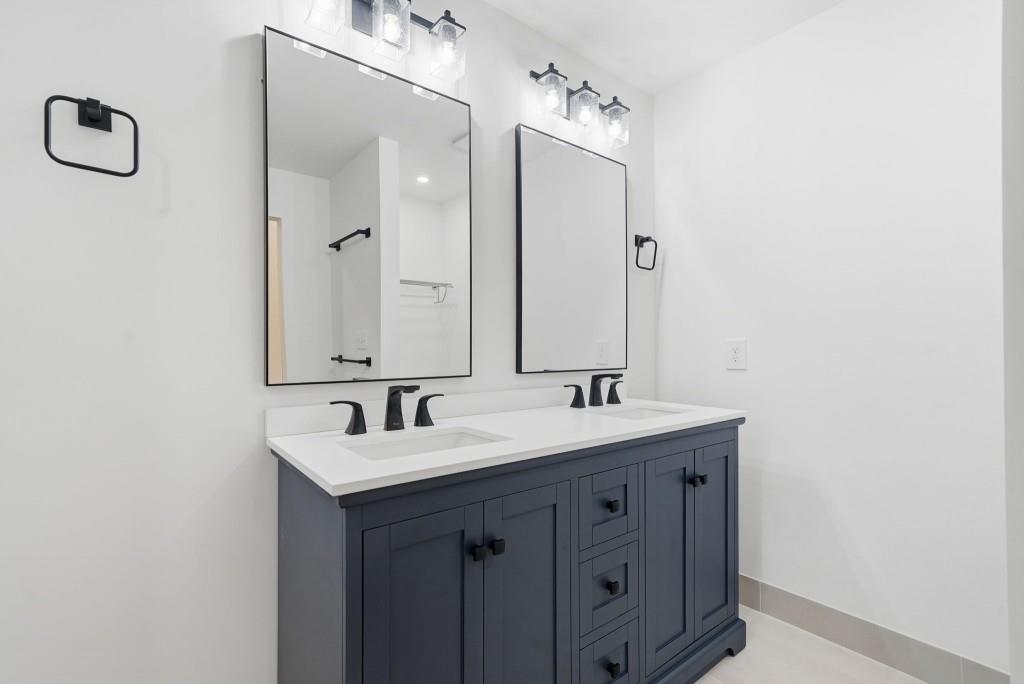 3668 Big Springs Road Decatur, GA 30034 - Photo 20 of 45 a bathroom with a double vanity sink and a mirror