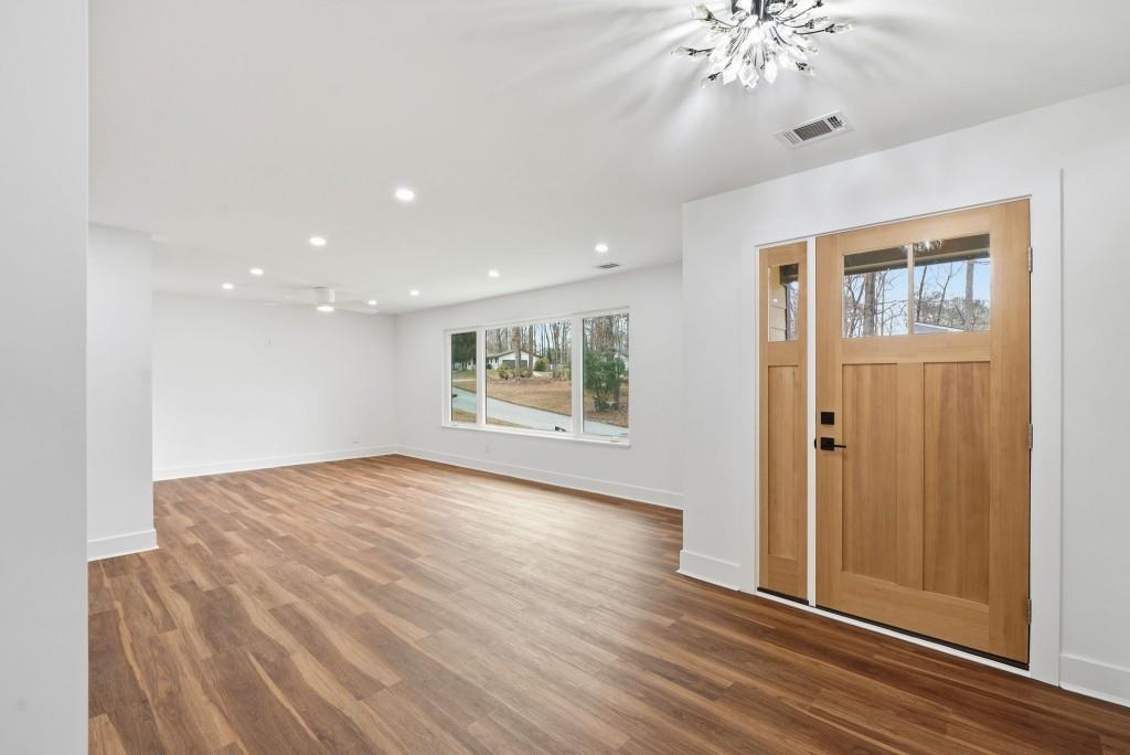 3668 Big Springs Road Decatur, GA 30034 - Photo 3 of 45 a view of an empty room with wooden floor and a window