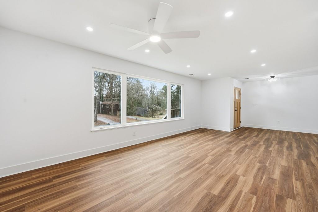 3668 Big Springs Road Decatur, GA 30034 - Photo 4 of 45 a view of an empty room with wooden floor and a window