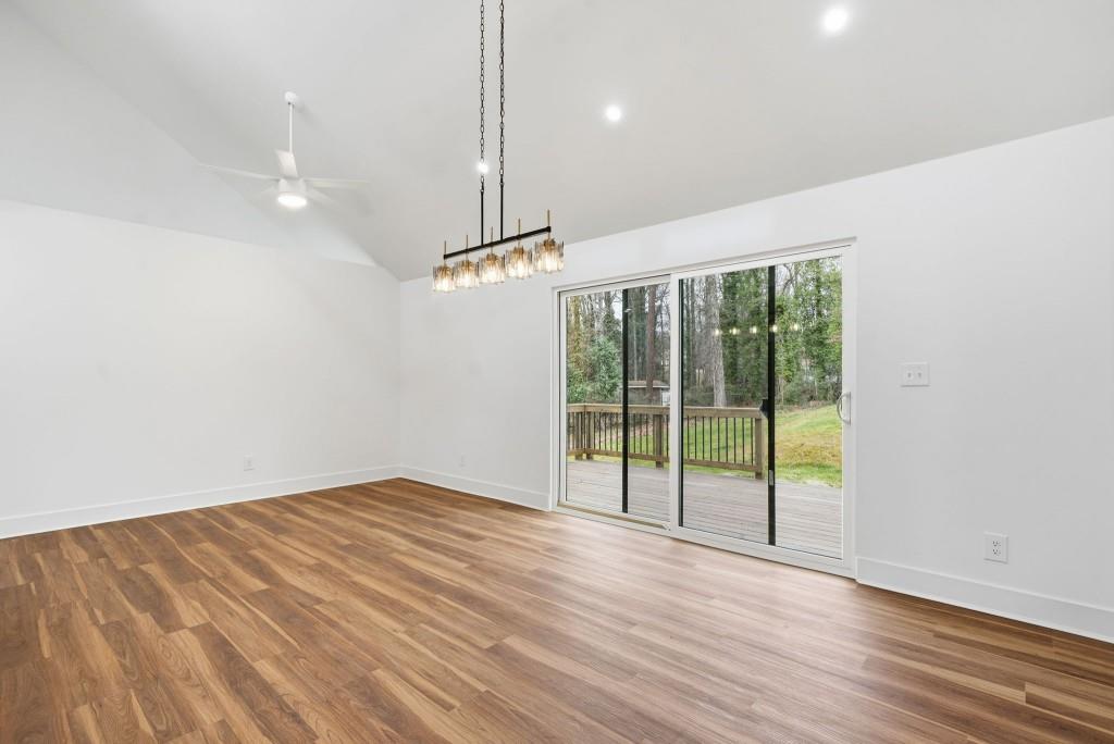 3668 Big Springs Road Decatur, GA 30034 - Photo 7 of 45 a view of an empty room with wooden floor and a window
