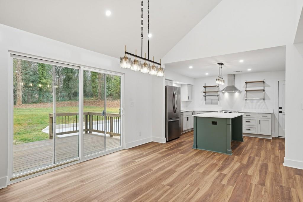 3668 Big Springs Road Decatur, GA 30034 - Photo 9 of 45 a kitchen with stainless steel appliances granite countertop a refrigerator oven a sink dishwasher and a wooden floor