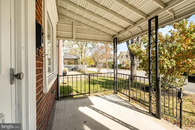 a view of a porch with a floor to ceiling window