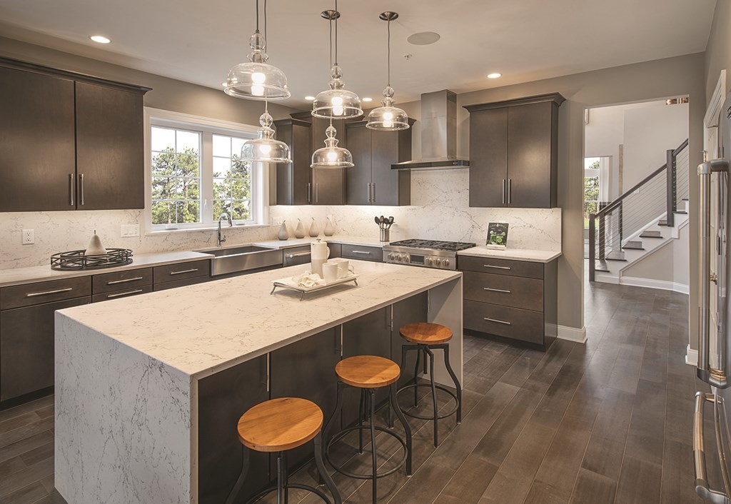 a kitchen with a sink a counter space and appliances