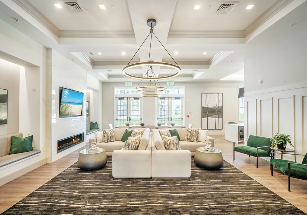 11 Hummingbird Way, Unit 148 Methuen, MA 01844 - Photo 13 of 16 a living room with furniture or couch and a chandelier