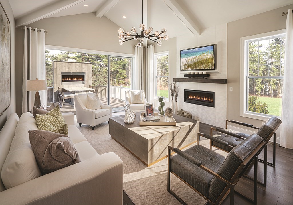 11 Hummingbird Way, Unit 148 Methuen, MA 01844 - Photo 3 of 16 a living room with fireplace furniture and a large window