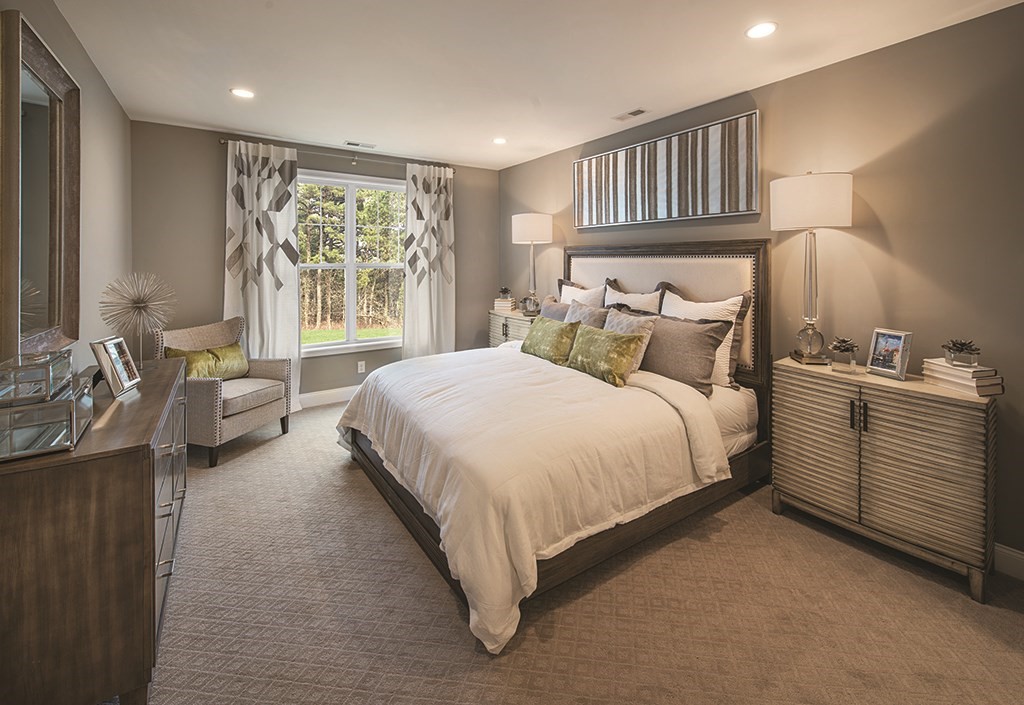 11 Hummingbird Way, Unit 148 Methuen, MA 01844 - Photo 5 of 16 a bed room with a bed and a night stand