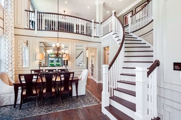 11 Hummingbird Way, Unit 148 Methuen, MA 01844 - Photo 7 of 16 a view of a dining room with wooden floor and a chandelier