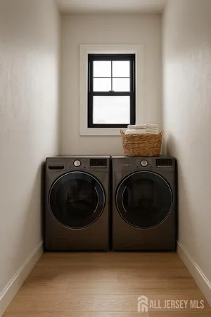 a utility room with sink dryer and washer