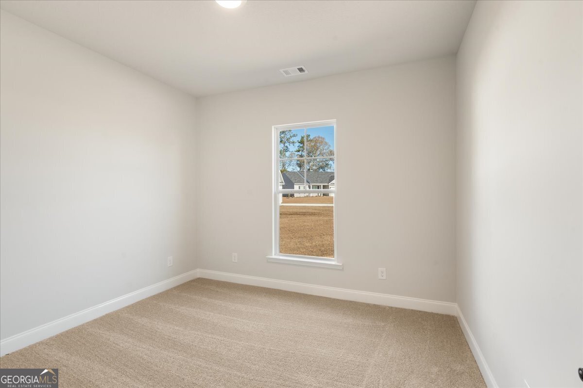 170 Foxridge Court Metter, GA 30439 - Photo 8 of 36 an empty room with a window