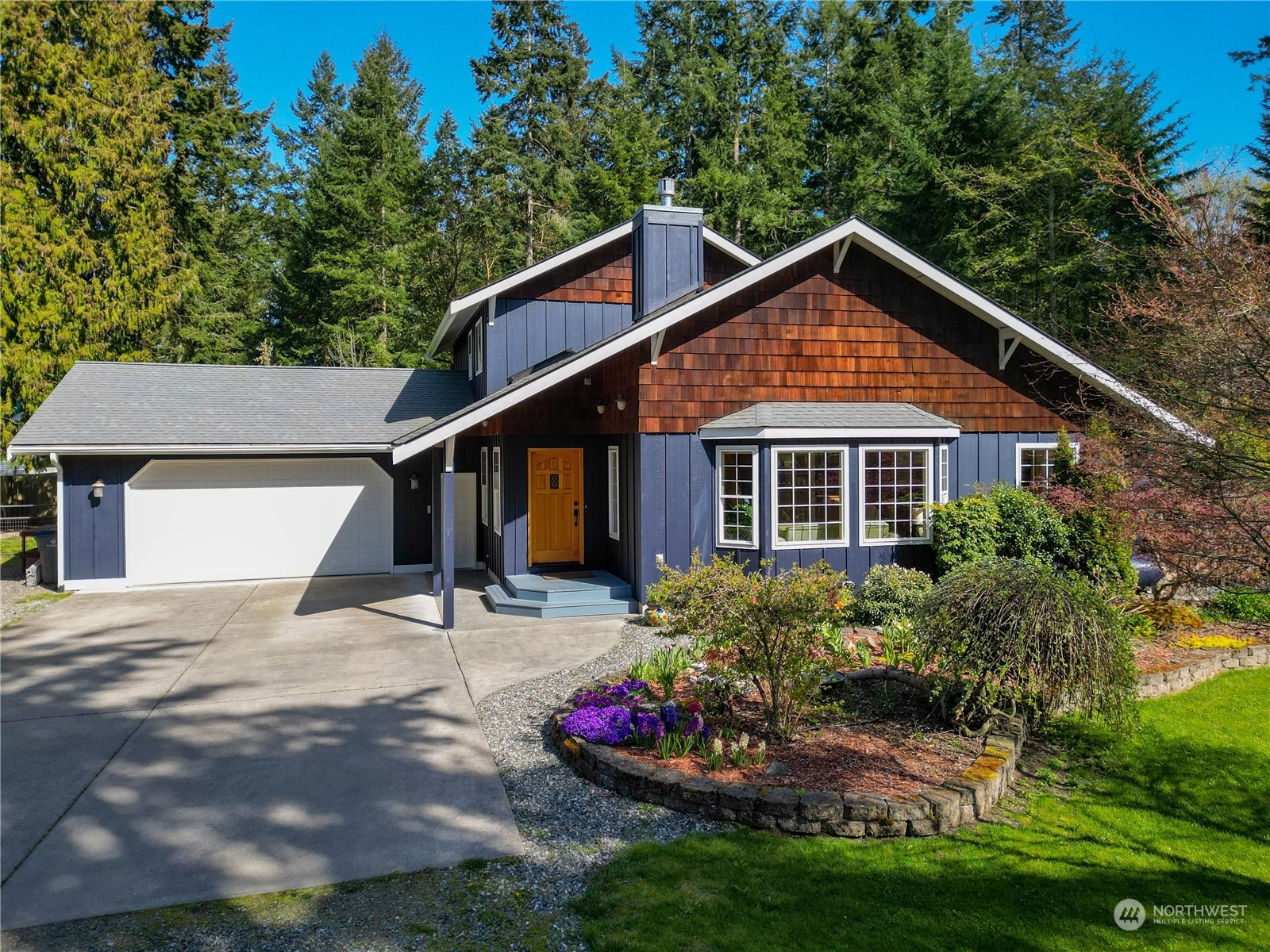 131 Riverside Road Sequim, WA 98382 - Photo 1 of 40 a front view of a house with a yard