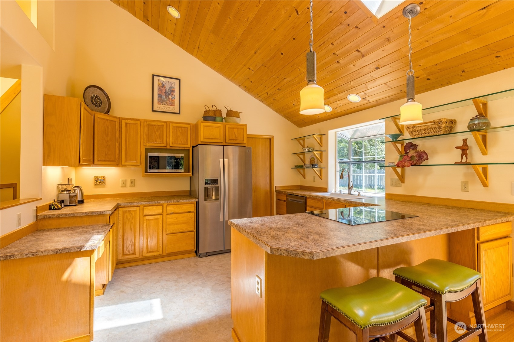 131 Riverside Road Sequim, WA 98382 - Photo 12 of 40 a kitchen with stainless steel appliances kitchen island granite countertop a sink and cabinets