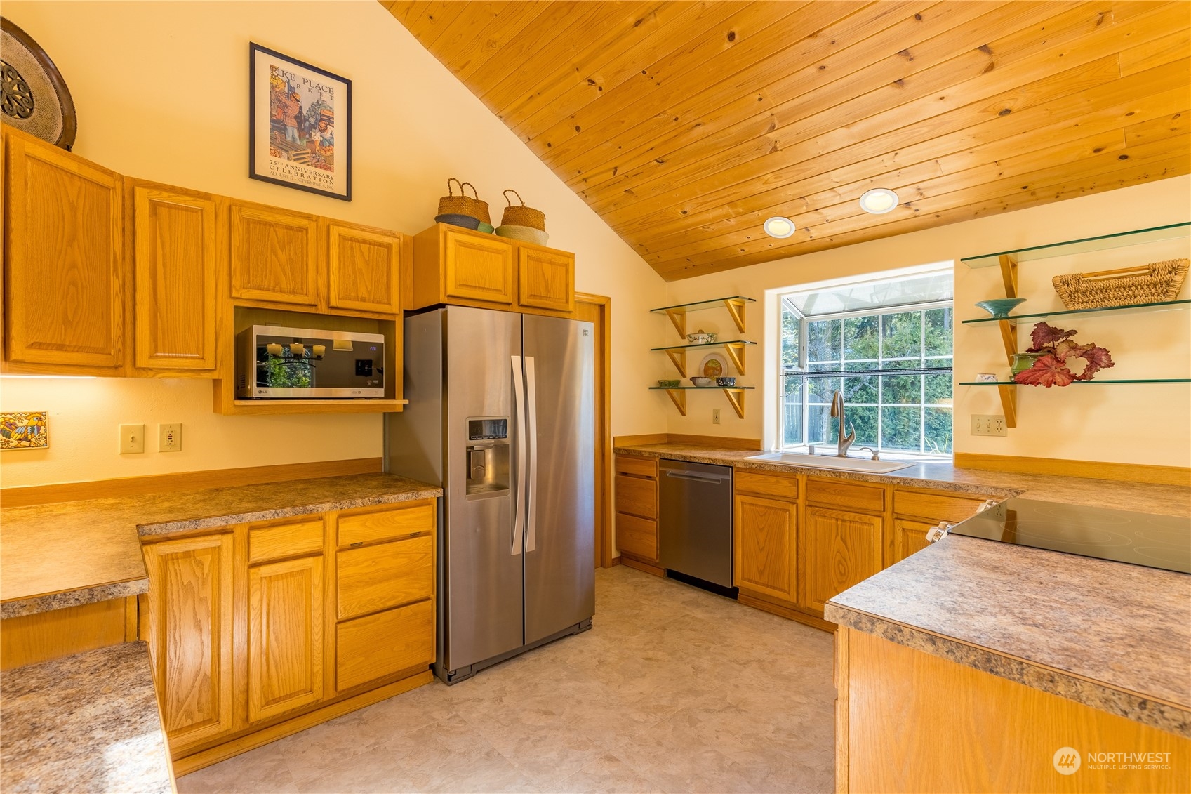 131 Riverside Road Sequim, WA 98382 - Photo 13 of 40 a kitchen with stainless steel appliances granite countertop a refrigerator and a stove top oven