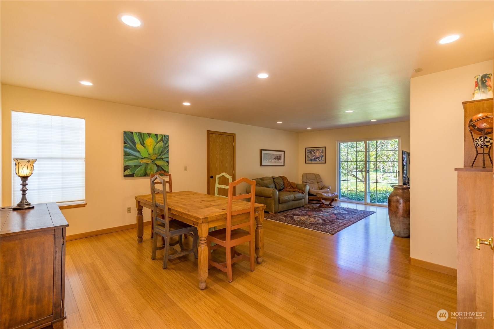 131 Riverside Road Sequim, WA 98382 - Photo 19 of 40 a view of a dining room with furniture window and wooden floor