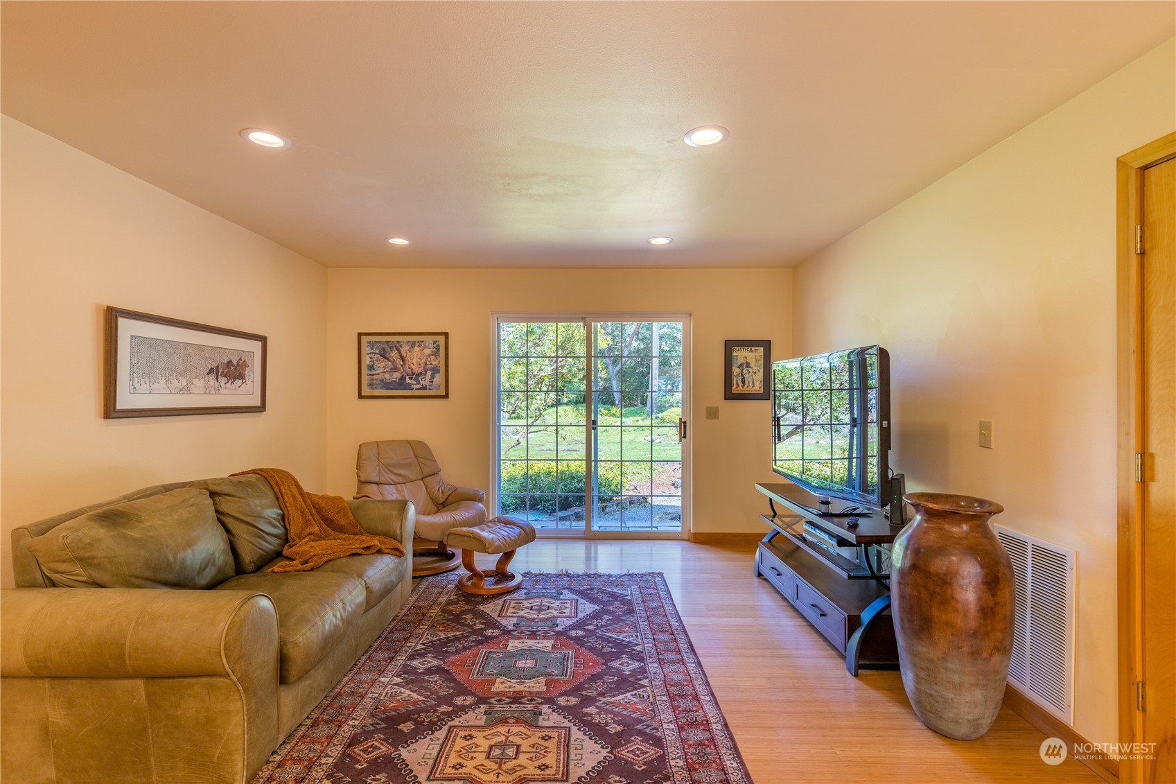131 Riverside Road Sequim, WA 98382 - Photo 20 of 40 a living room with furniture and a flat screen tv
