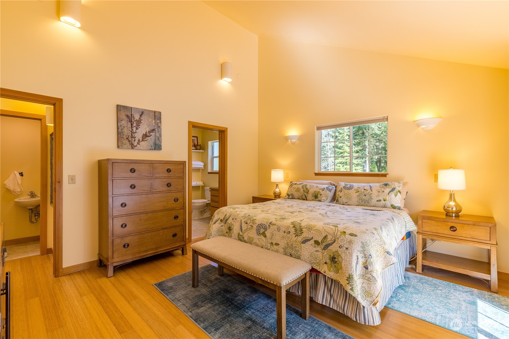 131 Riverside Road Sequim, WA 98382 - Photo 23 of 40 a bedroom with a bed and a cabinets