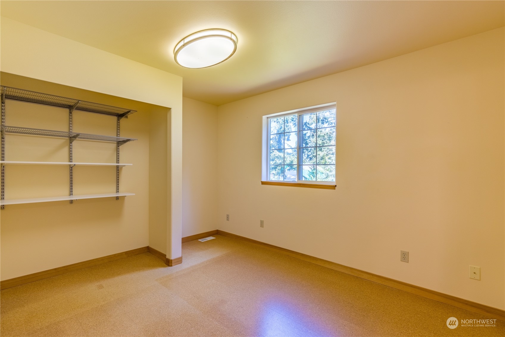 131 Riverside Road Sequim, WA 98382 - Photo 30 of 40 a view of a room with wooden floor and white walls