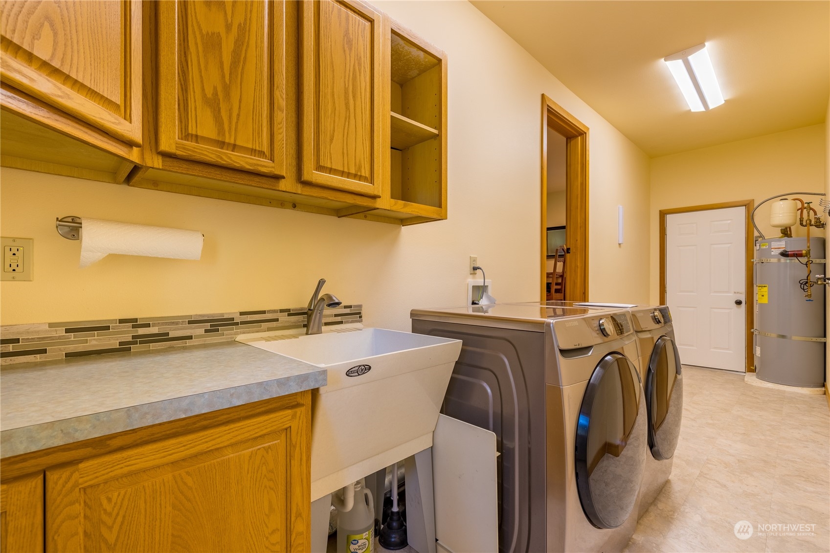 131 Riverside Road Sequim, WA 98382 - Photo 32 of 40 a utility room with dryer and washer