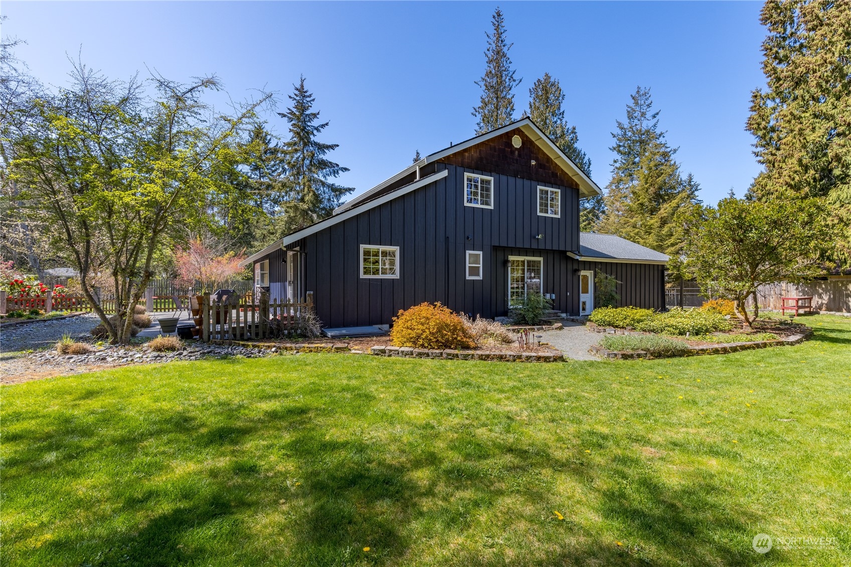 131 Riverside Road Sequim, WA 98382 - Photo 38 of 40 a view of a house with a yard and sitting area