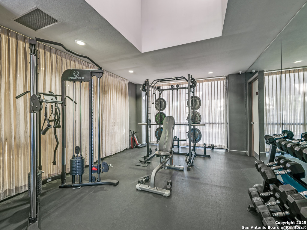 7701 Wurzbach Road, Unit 806 San Antonio, TX 78229 - Photo 13 of 20 a view of a room with gym equipment