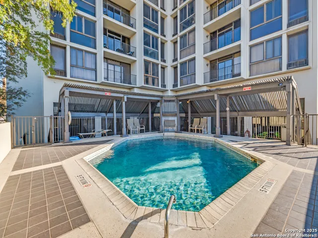 front view of a building with a swimming pool