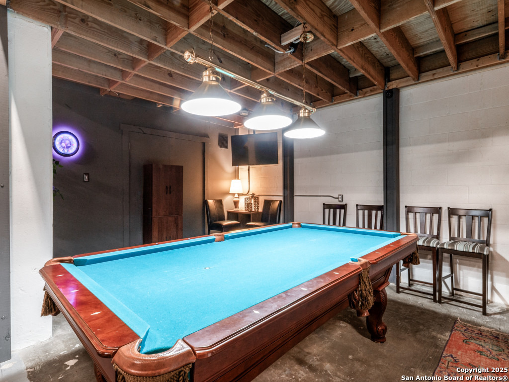 7701 Wurzbach Road, Unit 806 San Antonio, TX 78229 - Photo 9 of 20 a room with chairs and pool table