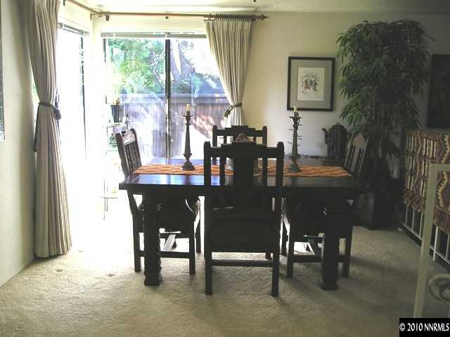 326 West Riverview Circle Reno, NV 89509 - Photo 3 of 9 a view of a dining room with furniture and chandelier