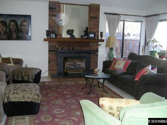 326 West Riverview Circle Reno, NV 89509 - Photo 4 of 9 a living room with furniture and a fireplace